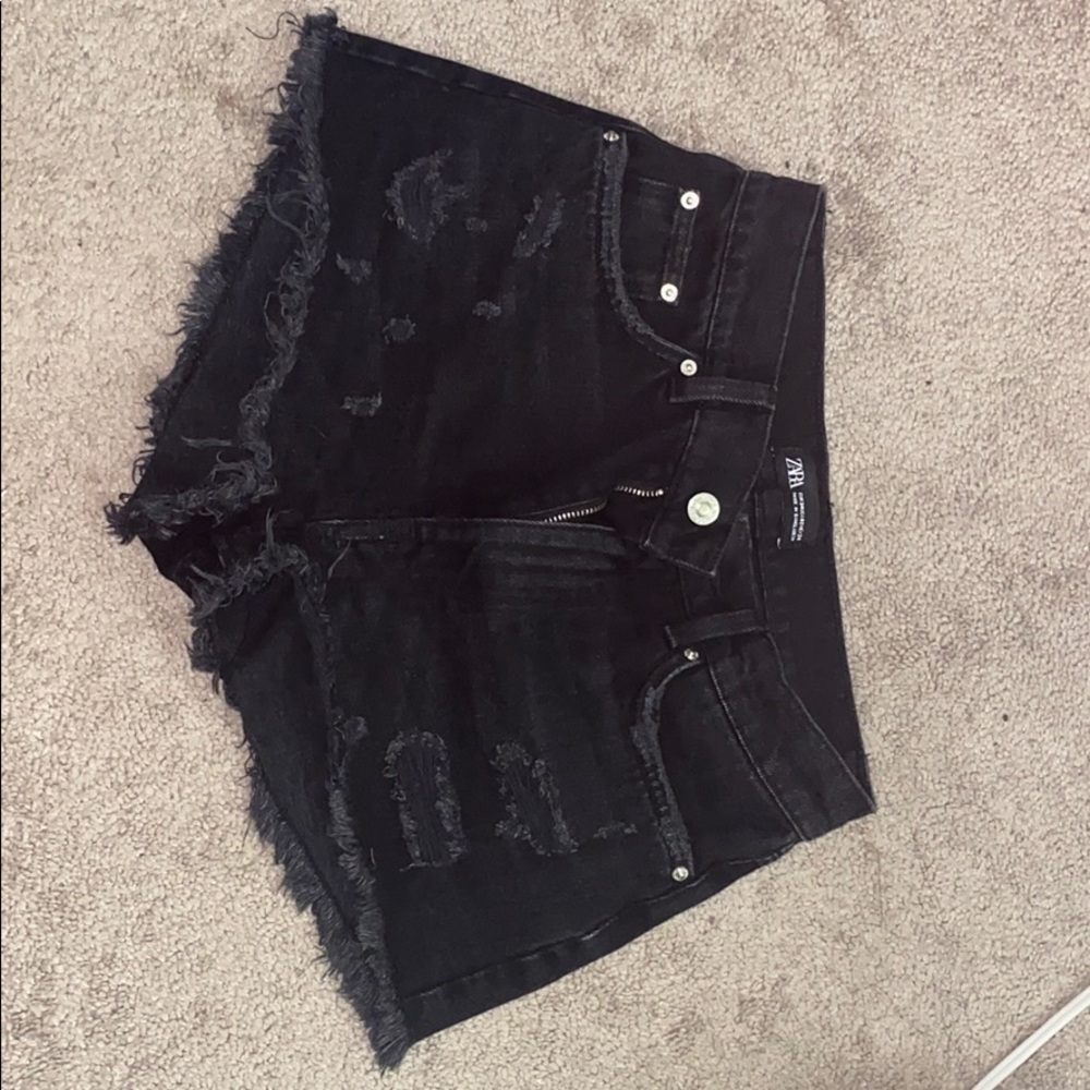 Distressed black jean shorts